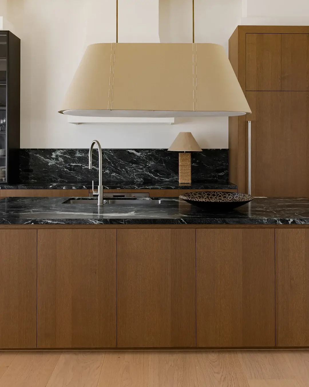 Contemporary kitchen of the Red Hill home showcasing Bayonne veneer island cabinetry.